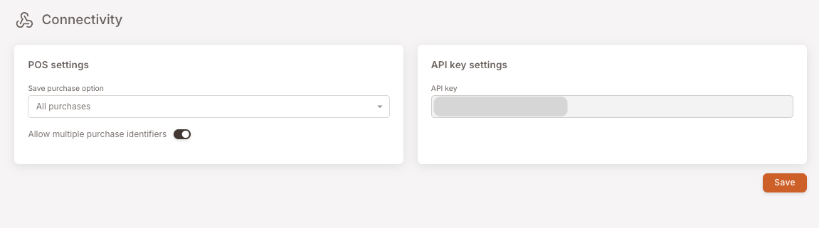 Connectivity page with two cards. Left: POS settings with Save purchase option set to "All purchases" and Allow multiple purchase identifiers toggle on. Right: API key settings with the API key field (value masked).