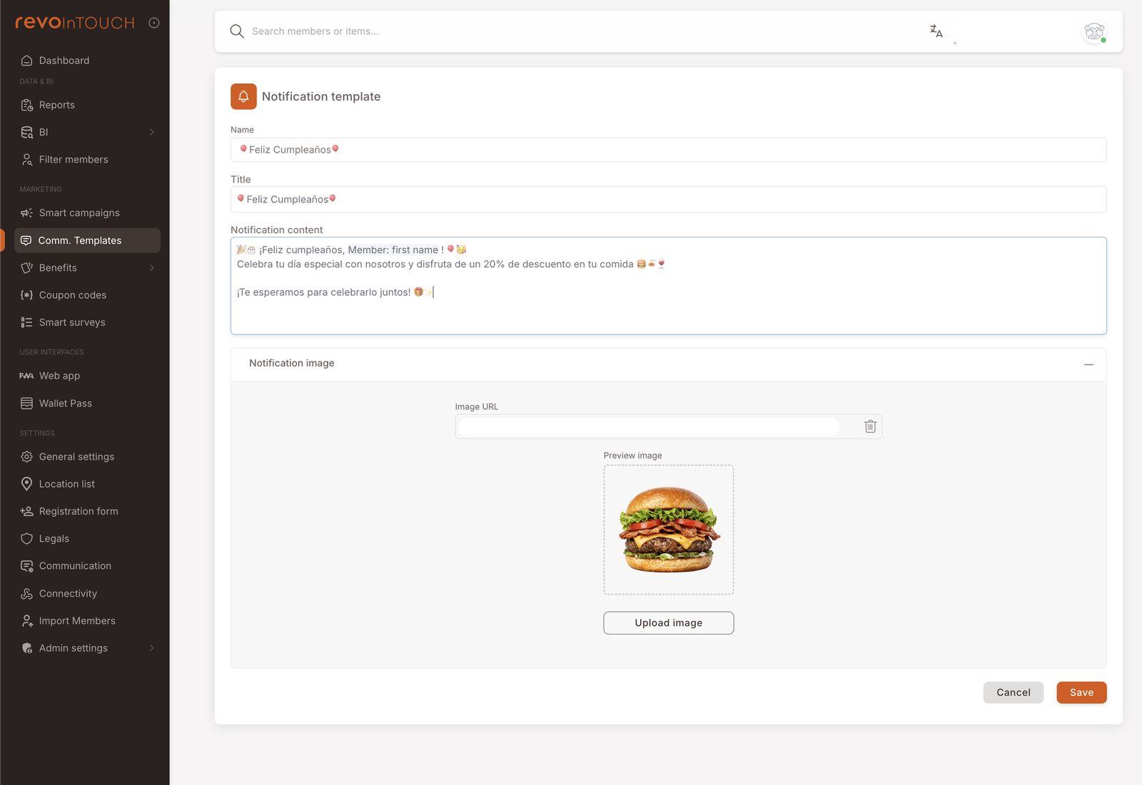 Notification template editor with Name "Feliz Cumpleaños", Title "Feliz Cumpleaños", and Notification content showing a body that uses the Member: first name dynamic field, emojis (🎂🎉, 🥗💛), and Spanish copy ("¡Feliz cumpleaños, Member: first name! Celebra tu día especial con nosotros y disfruta de un 20% de descuento en tu comida ¡Te esperamos para celebrarlo juntos!"). Below the body, the Notification image section is expanded, showing an Image URL field, a Preview image thumbnail (a burger photo), and an Upload image button. Cancel / Save buttons at the bottom right.